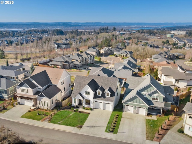 birds eye view of property with a residential view