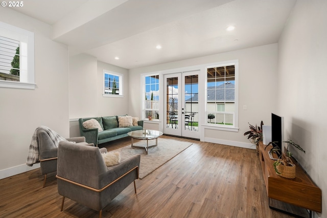 living room featuring recessed lighting, french doors, baseboards, and wood finished floors