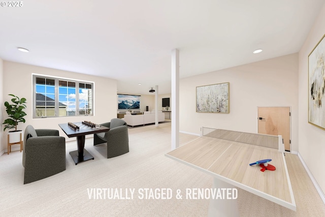 interior space with recessed lighting, light colored carpet, and baseboards