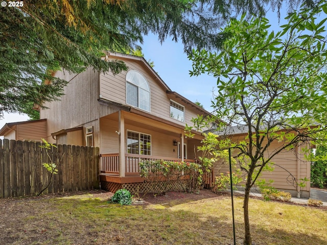 view of front of property featuring a front lawn and a porch