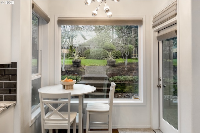 dining space featuring an inviting chandelier