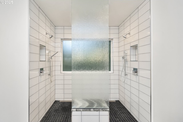 bathroom featuring tiled shower