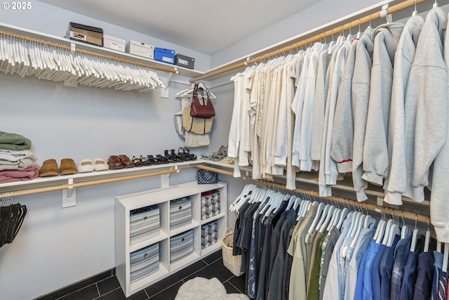 spacious closet with tile patterned flooring