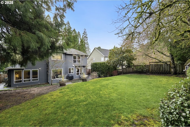 view of yard with a fenced backyard