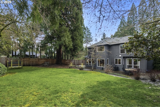 view of yard with a fenced backyard and a patio area