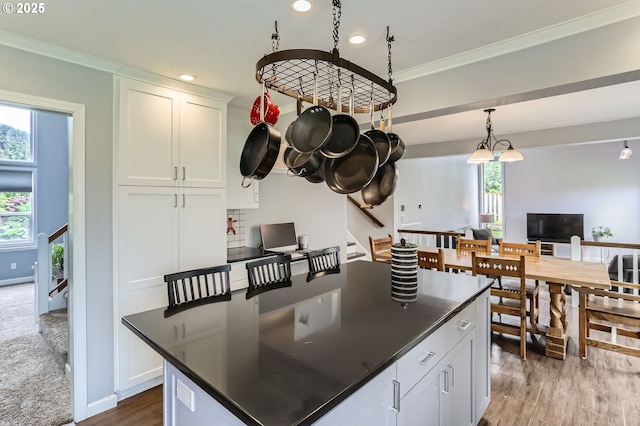 1543 NE Hyde St, Hillsboro, OR 97124 - kitchen with dark countertops, white cabinets, dark wood finished floors, recessed lighting, and ornamental molding