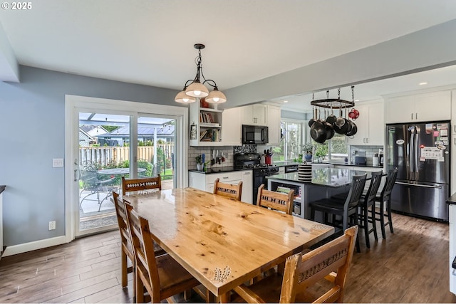 1543 NE Hyde St, Hillsboro, OR 97124 - dining space with dark wood-type flooring, baseboards, and recessed lighting