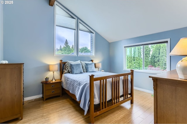 1543 NE Hyde St, Hillsboro, OR 97124 - bedroom with vaulted ceiling, baseboards, and light wood finished floors