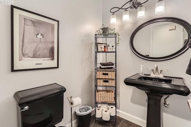 1543 NE Hyde St, Hillsboro, OR 97124 - half bath featuring toilet, baseboards, and tile patterned flooring