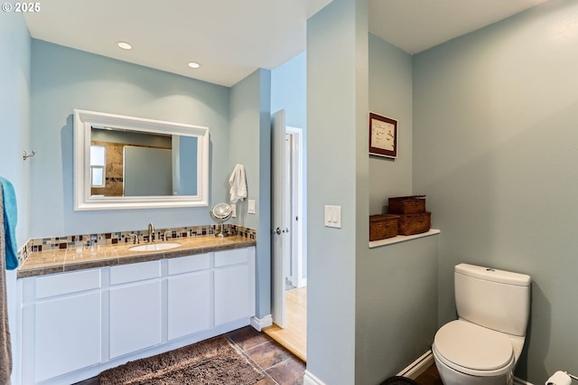 1543 NE Hyde St, Hillsboro, OR 97124 - bathroom with vanity, toilet, and baseboards