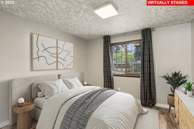 1213 NW Westridge St, Vancouver, WA 98665 - bedroom with a textured ceiling and wood finished floors