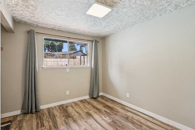 1213 NW Westridge St, Vancouver, WA 98665 - unfurnished room featuring wood finished floors and a textured ceiling