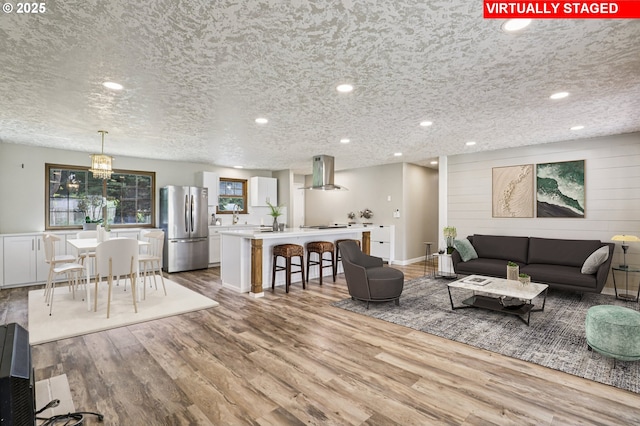 1213 NW Westridge St, Vancouver, WA 98665 - living area with wood finished floors, recessed lighting, a chandelier, and a textured ceiling