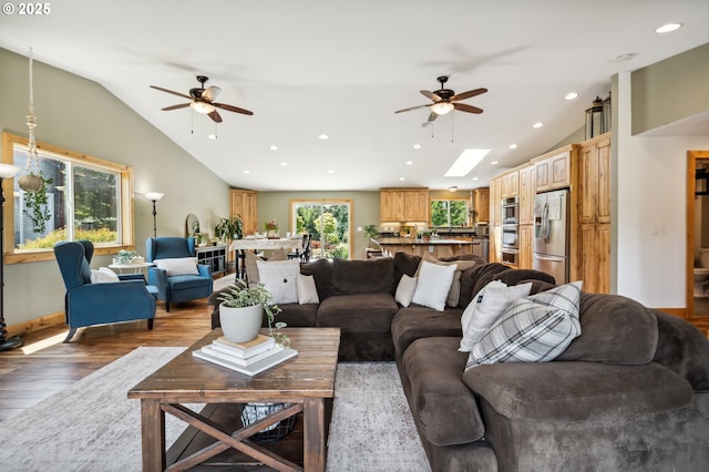 40774 SE Trubel Rd, Sandy, OR 97055 - living area with a ceiling fan, vaulted ceiling, wood finished floors, recessed lighting, and a skylight