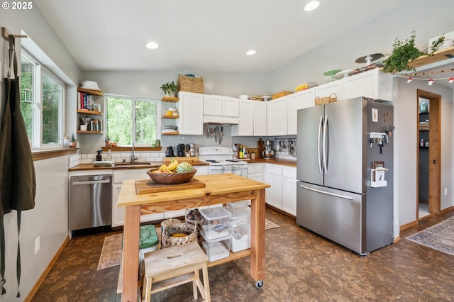 40774 SE Trubel Rd, Sandy, OR 97055 - kitchen with appliances with stainless steel finishes, white cabinets, open shelves, recessed lighting, and dark floors