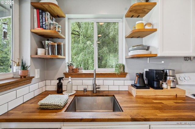 40774 SE Trubel Rd, Sandy, OR 97055 - kitchen featuring open shelves, wood counters, and white cabinetry