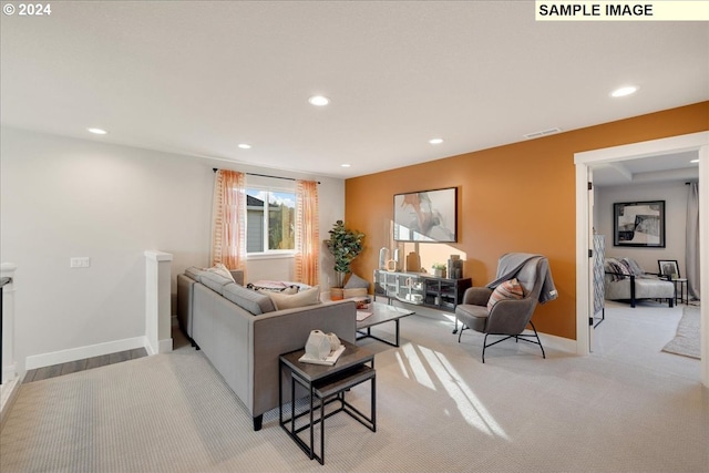 living room with light colored carpet