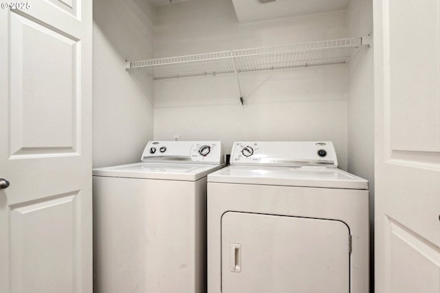 washroom with independent washer and dryer