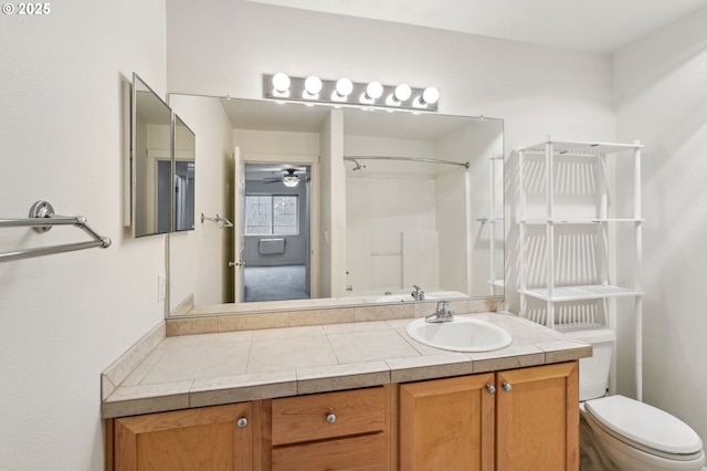 bathroom with vanity, walk in shower, and toilet