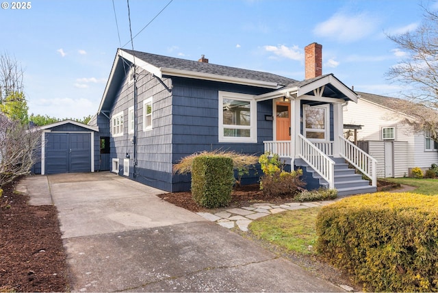 bungalow-style house with a storage unit