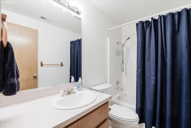 bathroom featuring vanity, shower / bath combo, toilet, and visible vents