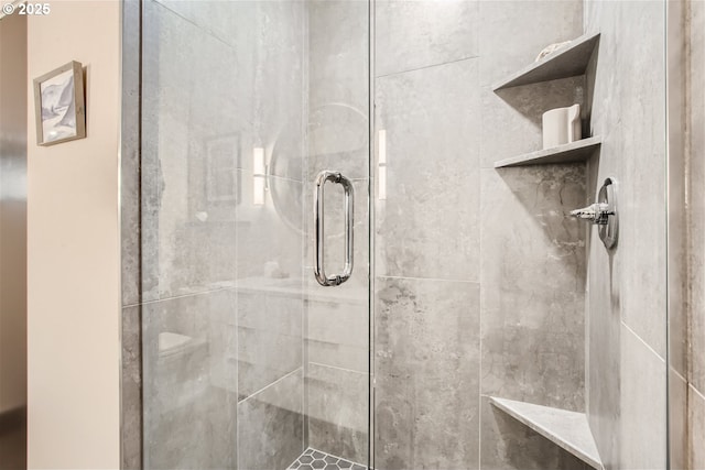 bathroom with toilet and a shower stall