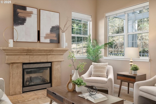 living area featuring a tile fireplace