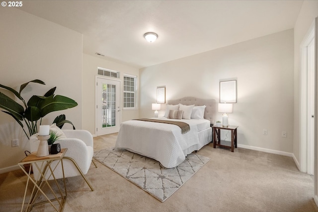 bedroom featuring light colored carpet, access to outside, and french doors