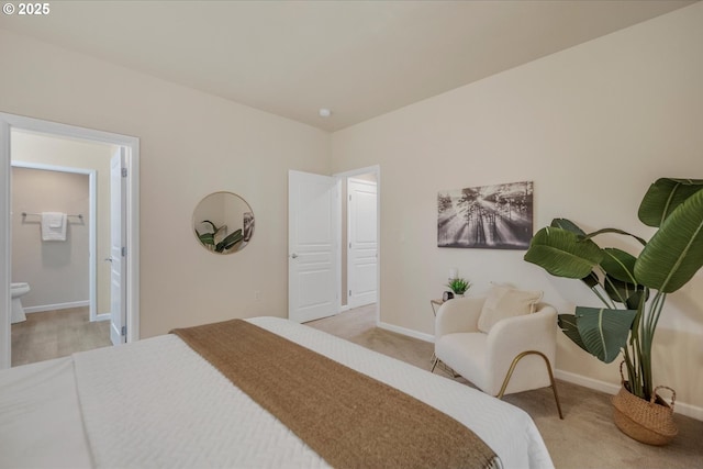 carpeted bedroom featuring connected bathroom