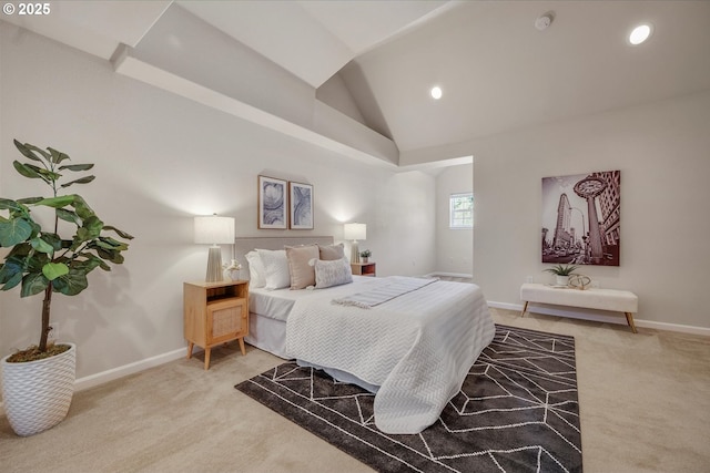 bedroom featuring carpet and high vaulted ceiling