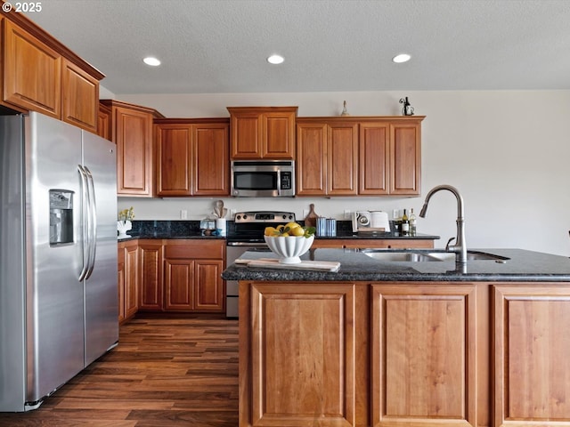 4257 SE Jetty Ave, Lincoln City, OR 97367 - kitchen with stainless steel appliances, brown cabinets, dark wood-type flooring, and a sink