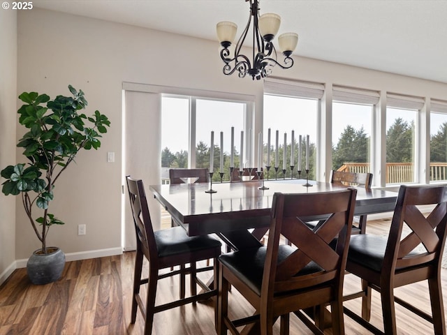 4257 SE Jetty Ave, Lincoln City, OR 97367 - dining space featuring light wood-type flooring, an inviting chandelier, and baseboards