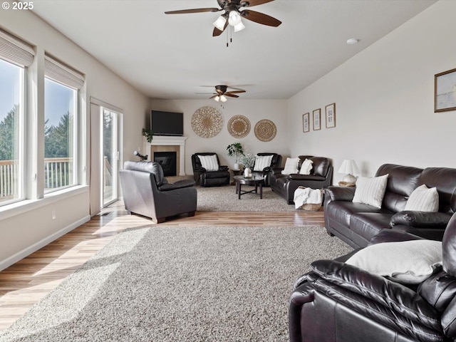 4257 SE Jetty Ave, Lincoln City, OR 97367 - living area with light wood finished floors, a ceiling fan, and plenty of natural light