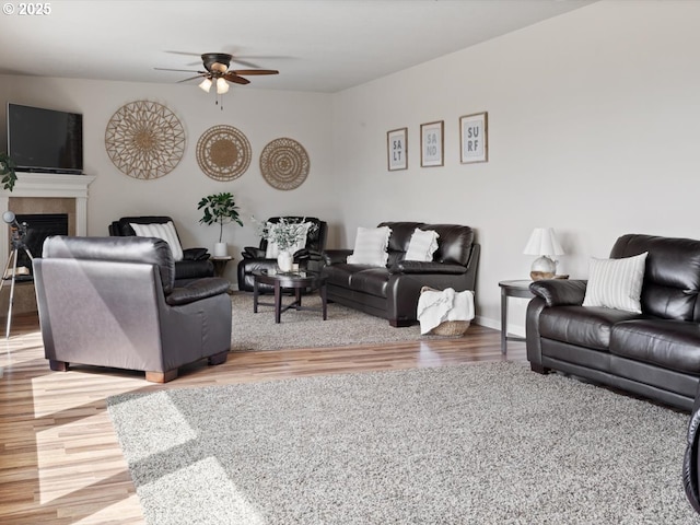 4257 SE Jetty Ave, Lincoln City, OR 97367 - living room with a ceiling fan, wood finished floors, and a fireplace