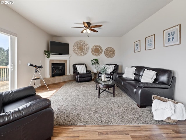 4257 SE Jetty Ave, Lincoln City, OR 97367 - living area featuring wood finished floors, ceiling fan, and a tiled fireplace