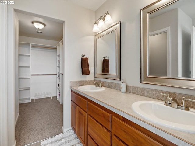 4257 SE Jetty Ave, Lincoln City, OR 97367 - bathroom with visible vents, double vanity, and a sink