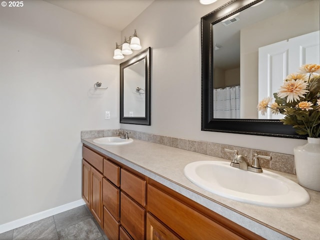 4257 SE Jetty Ave, Lincoln City, OR 97367 - bathroom featuring double vanity, a sink, baseboards, and visible vents