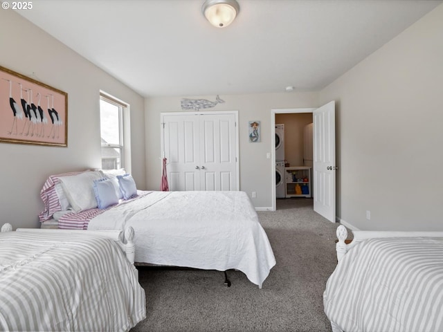 4257 SE Jetty Ave, Lincoln City, OR 97367 - bedroom featuring a closet, stacked washer / dryer, baseboards, and carpet floors
