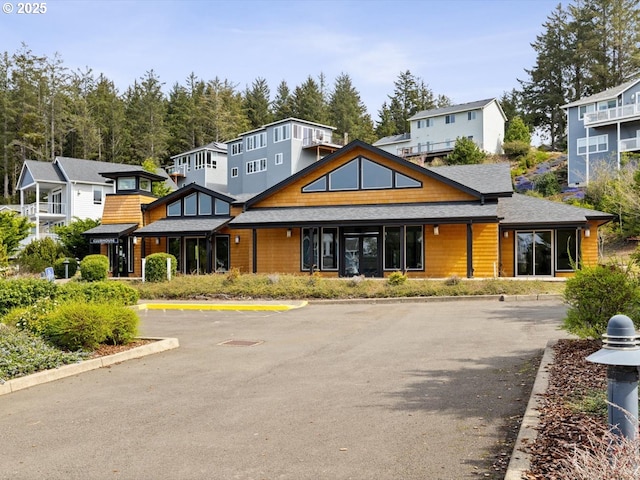 4257 SE Jetty Ave, Lincoln City, OR 97367 - back of property featuring a residential view, uncovered parking, and a shingled roof