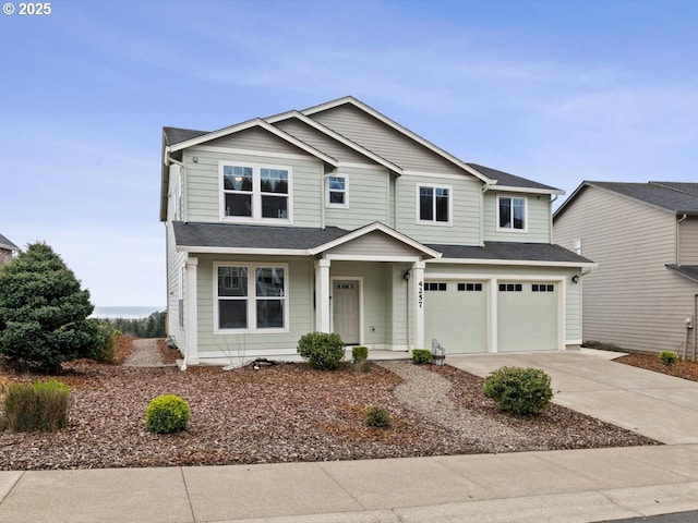 4257 SE Jetty Ave, Lincoln City, OR 97367 - view of front of property with a porch, a shingled roof, driveway, and an attached garage