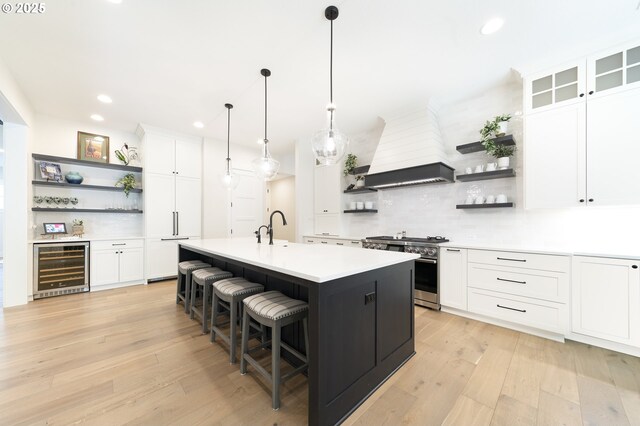 1931 13th St, West Linn, OR 97068 - kitchen with open shelves, wine cooler, high end stainless steel range oven, light countertops, and recessed lighting