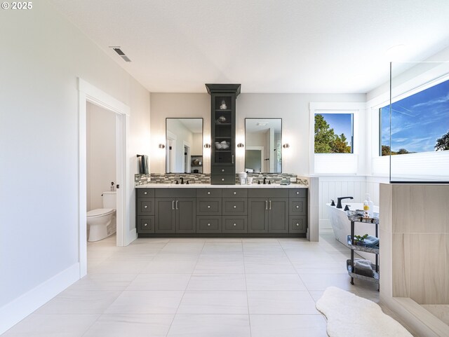 1931 13th St, West Linn, OR 97068 - full bathroom with double vanity, tile patterned flooring, and a tub to relax in