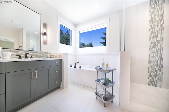 1931 13th St, West Linn, OR 97068 - bathroom with a soaking tub, vanity, a walk in shower, tasteful backsplash, and a wainscoted wall