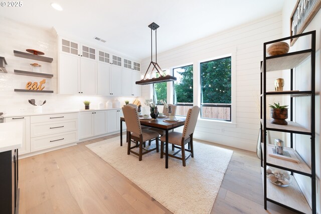 1931 13th St, West Linn, OR 97068 - dining space featuring light wood-style flooring, recessed lighting, and wood walls