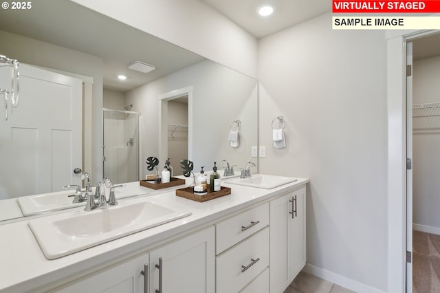 bathroom with vanity, an enclosed shower, and tile patterned flooring