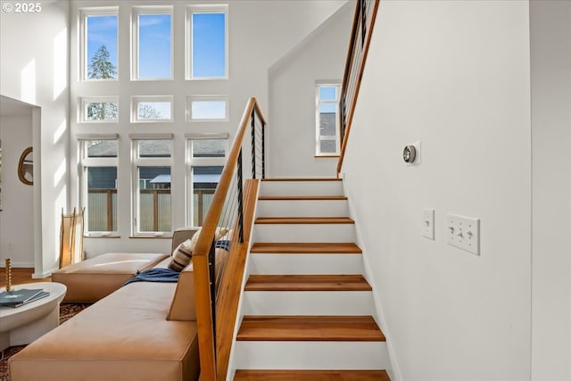 stairway featuring baseboards