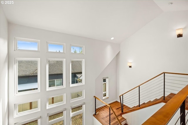 staircase with wood finished floors