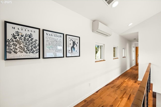 8316 SE 7th Ave, Portland, OR 97202 - hall with a wall mounted AC, lofted ceiling, wood finished floors, recessed lighting, and baseboards