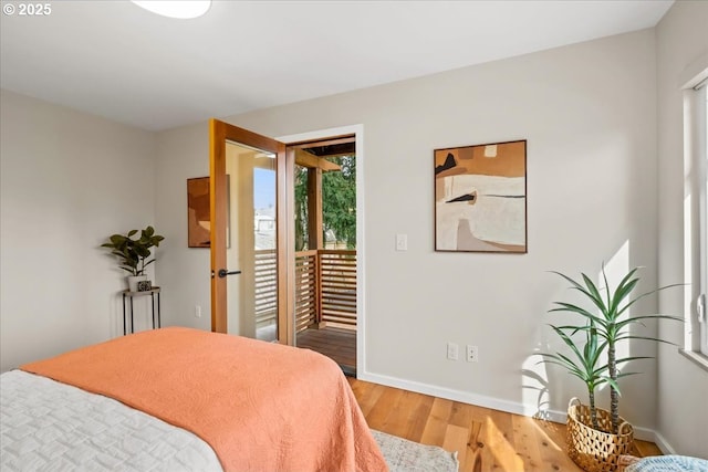 8316 SE 7th Ave, Portland, OR 97202 - bedroom with access to outside, light wood finished floors, and baseboards