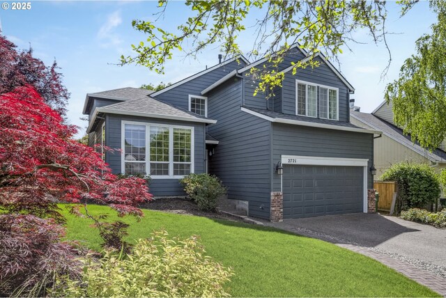 traditional-style house with an attached garage, asphalt driveway, and roof with shingles